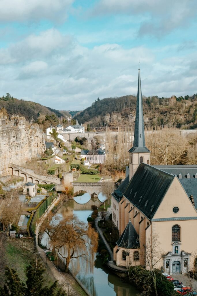 A stunning aerial view of Neumunster Abbey, surrounded by nature in Luxembourg City.