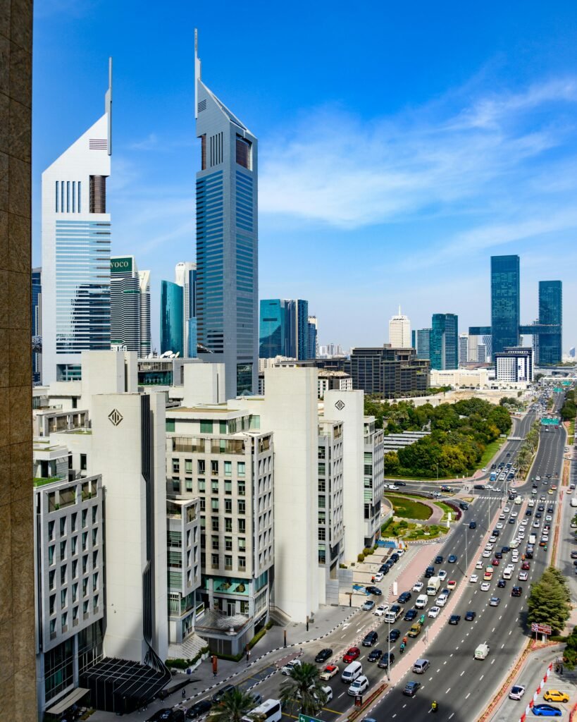 Skyline view featuring Emirates Towers in Dubai on a sunny day.